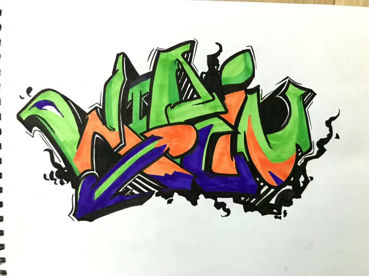 Green, orange, purple, and black graffiti lettering on a sketchbook page.