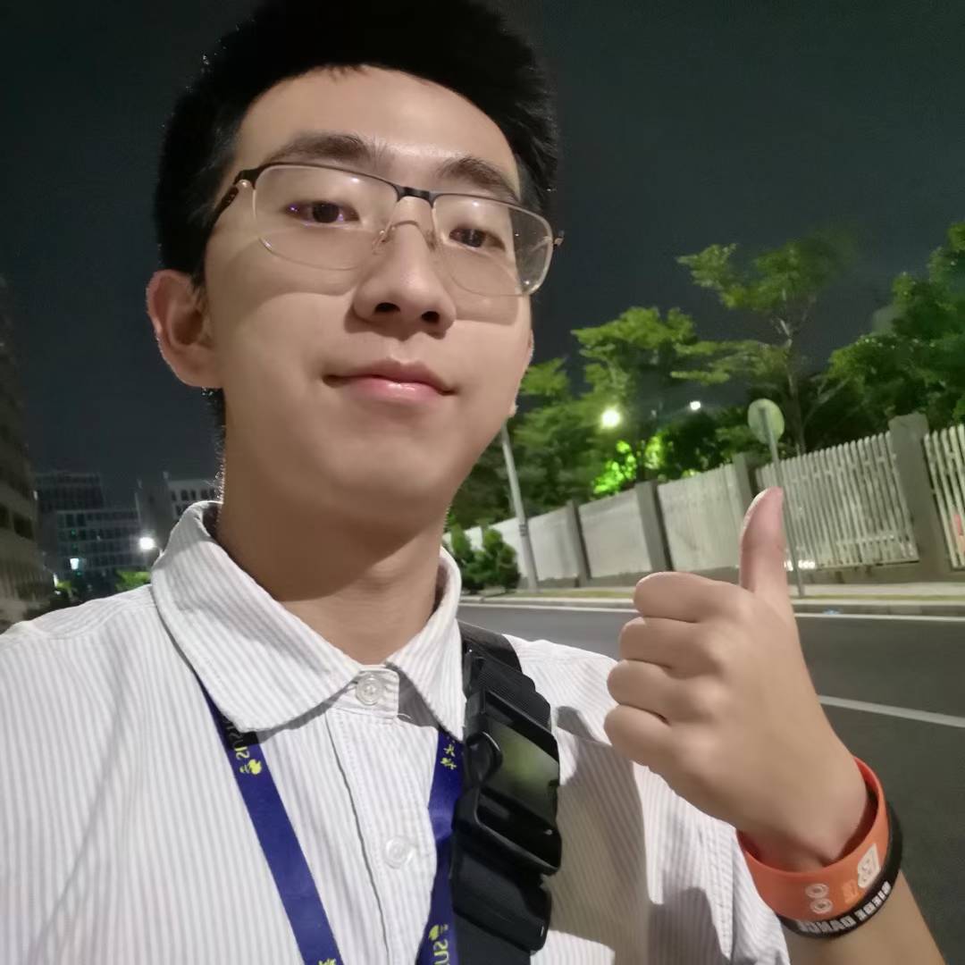 A nighttime selfie giving a thumbs up while wearing a university lanyard.